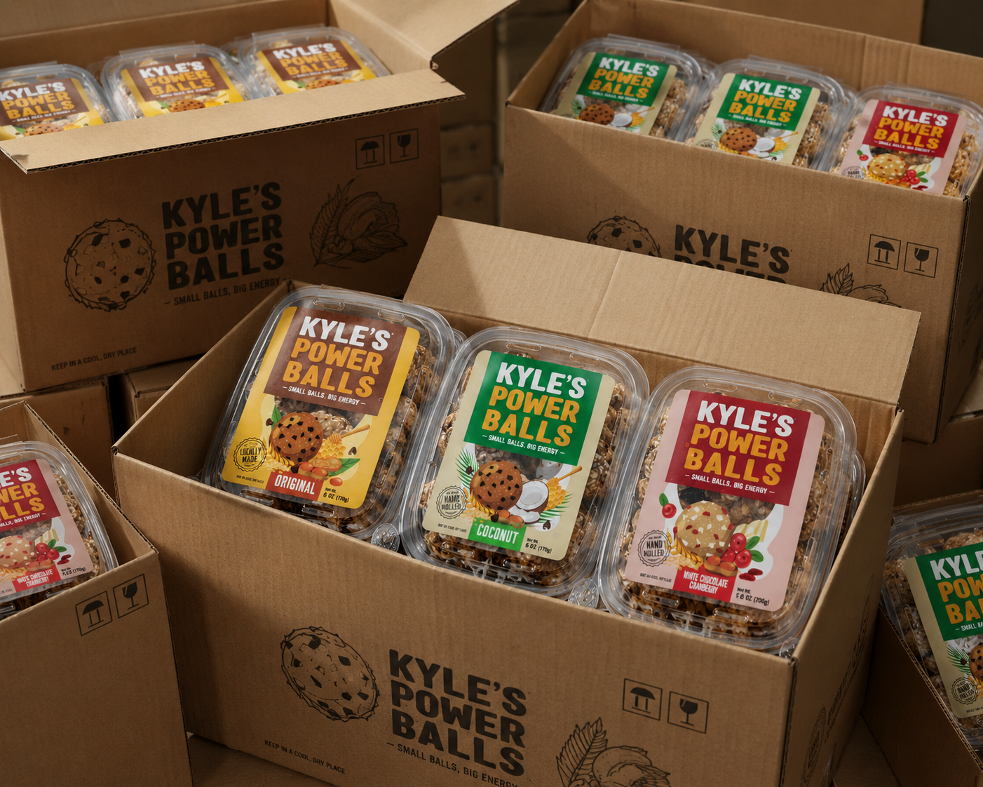 Cases of Kyle's Power Balls Original, Coconut, and White Chocolate Cranberry packed for wholesale